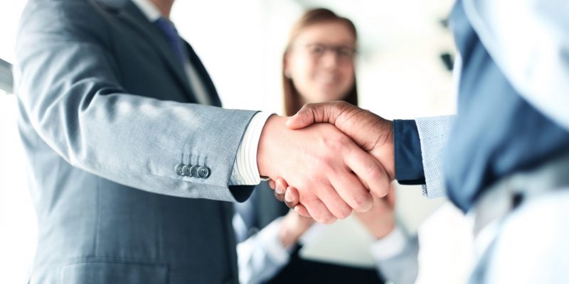Business people shaking hands, finishing up a meeting